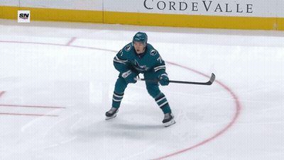 A Hockey Player With The Number 73 On Their Back GIF