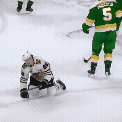 A Hockey Player With The Number 8 On His Jersey Is Kneeling On The Ice GIF