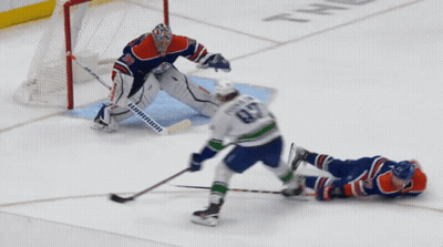 A Hockey Player With The Number 82 On His Jersey Is Laying On The Ice GIF