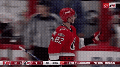 A Hockey Player With The Number 82 On His Shirt GIF