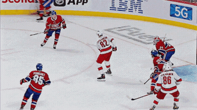 A Hockey Player With The Number 86 On His Jersey Celebrates His Goal GIF