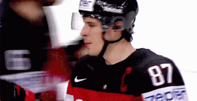 A Hockey Player With The Number 87 On His Shirt GIF