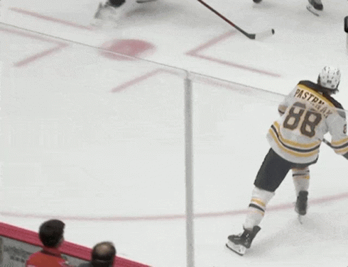 A Hockey Player With The Number 88 On His Back GIF