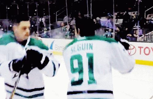 A Hockey Player With The Number 91 On Their Back GIF
