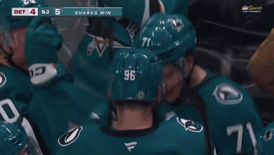 A Hockey Player With The Number 96 On His Helmet Is Surrounded By Other Players GIF