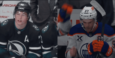 A Hockey Player With The Number 97 On His Helmet Stands Next To Another Player GIF