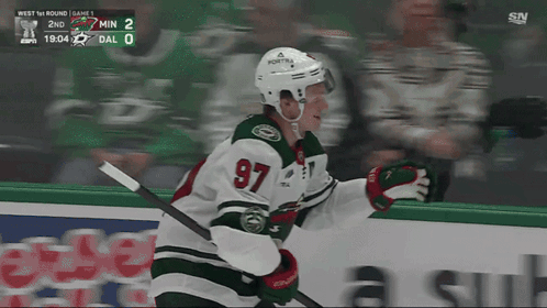 A Hockey Player With The Number 97 On His Jersey Is On The Ice GIF