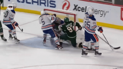 A Hockey Player With The Number 97 On His Jersey GIF