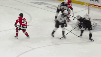 A Hockey Player With The Number 98 On His Jersey Is Kneeling On The Ice GIF