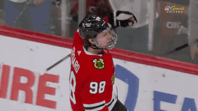 A Hockey Player With The Number 98 On His Shirt GIF