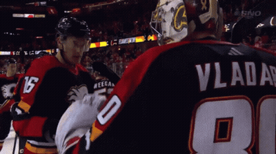 A Hockey Player With Vladar On His Back GIF