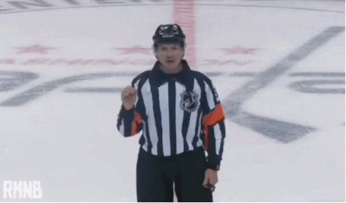A Hockey Referee With His Arms Outstretched And The Word Rmnb In The Corner GIF