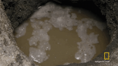 A Hole In The Ground With A National Geographic Logo GIF