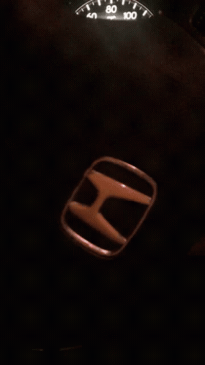 A Honda Emblem Sits Next To The Speedometer GIF