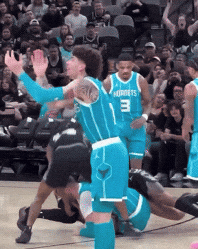 A Hornets Player With The Number 3 On His Jersey Is Playing Basketball GIF