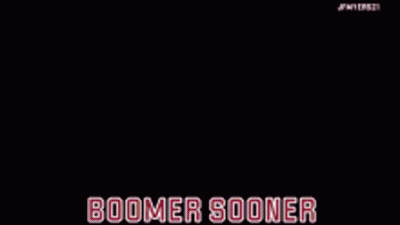A Horse Drawn Carriage On A Football Field With The Words Boomer Sooner On The Bottom GIF
