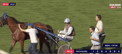 A Horse Drawn Carriage Race Is Being Shown On A Television Screen GIF