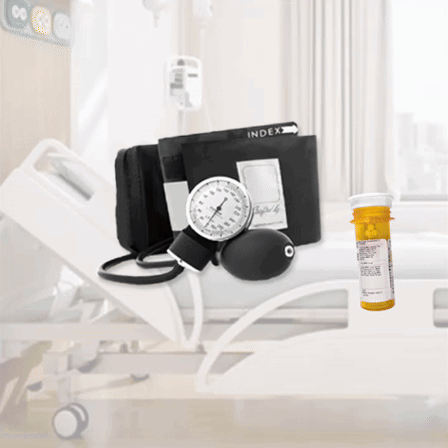 A Hospital Bed With A Bottle Of Medication And A Blood Pressure Monitor GIF