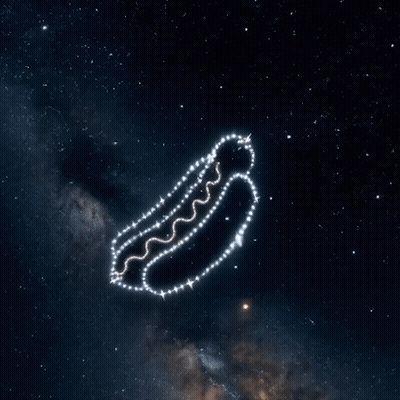 A Hot Dog Made Of Stars Is Flying Through The Air GIF