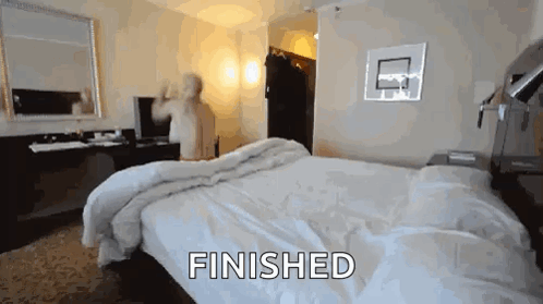 A Hotel Room With A Bed And The Word Finished On The Bottom GIF