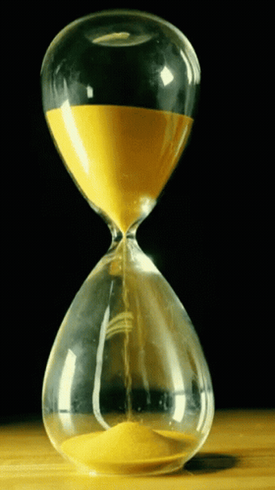 A Hourglass With Yellow Sand Coming Out Of It Against A Black Background GIF