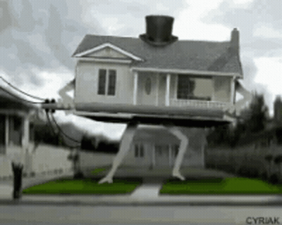 A House With A Top Hat On Top Of It Is On Stilts . GIF