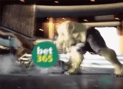 A Hulk Is Standing In Front Of A Bet Advertisement GIF