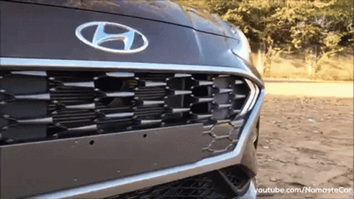 A Hyundai Car Is Parked In The Dirt GIF
