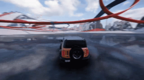 A Jeep Is Driving Down A Road With A Tire That Says ' I ' On It GIF