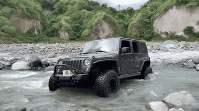 A Jeep With A License Plate That Says ' Jeep ' On It Is Driving Through A River GIF
