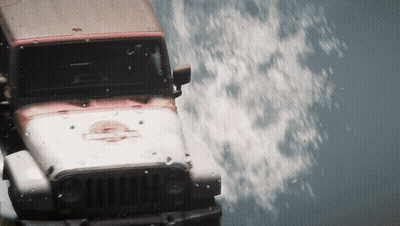 A Jeep With The Word Jurassic Park Painted On The Front GIF