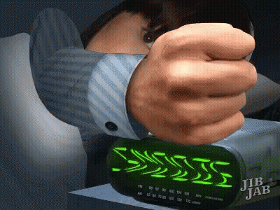 A Jib Jab Alarm Clock Is Being Turned On By A Man GIF