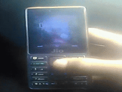 A Jio Phone Is Being Held By A Hand GIF