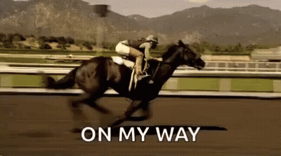A Jockey Is Riding A Horse On A Race Track With The Words `` On My Way '' Written On The Bottom . GIF