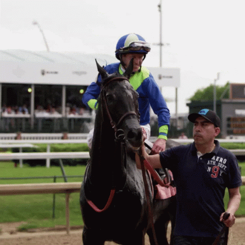 A Jockey Wearing A Blue Shirt That Says Aero Athletic On It GIF