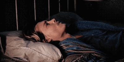 A Johnny Depp Gif Is Shown Of A Man Laying In A Bed GIF