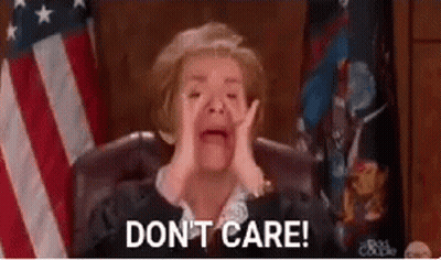 A Judge Is Crying While Sitting In Front Of An American Flag And Says `` Do N't Care '' . GIF