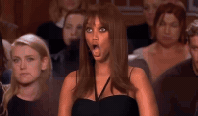 A Judge Is Holding A Piece Of Paper With A Picture Of A Woman On It GIF