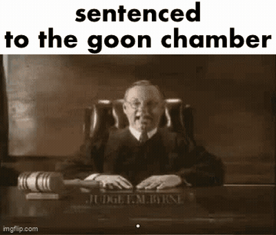 A Judge Is Sitting At A Desk In A Courtroom Holding A Gavel And A Book . GIF