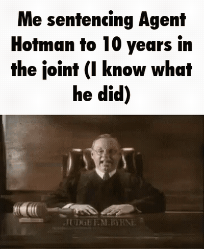 A Judge Is Sitting At A Desk In A Courtroom With A Gavel . GIF