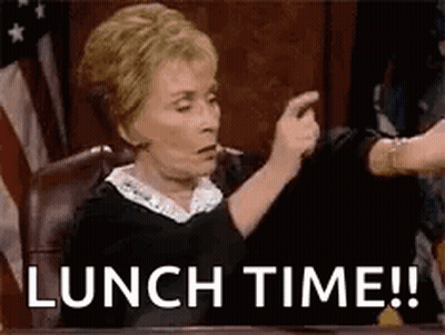 A Judge Is Sitting At A Table And Pointing At Someone While Saying Lunch Time . GIF