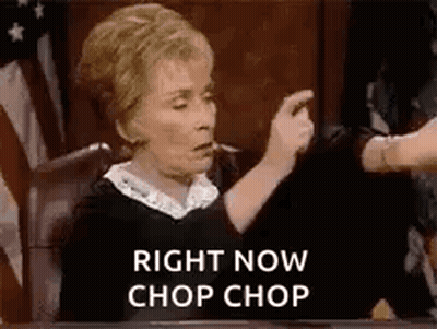 A Judge Is Sitting At A Table In A Courtroom Giving A Thumbs Down Sign . GIF
