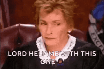 A Judge Is Sitting In A Courtroom With A Serious Look On Her Face . GIF
