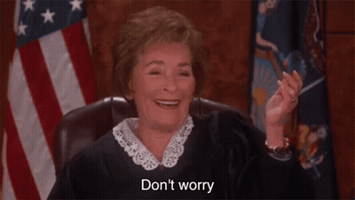 A Judge Is Smiling While Sitting In Front Of An American Flag And Saying `` Do N't Worry '' . GIF