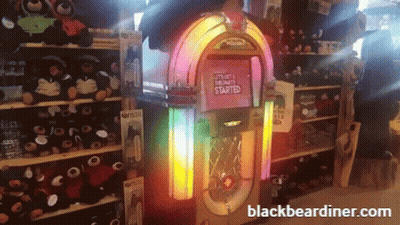 A Jukebox That Says " Let 'S Get This Party Started " On It GIF