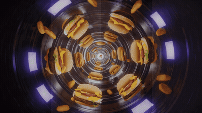 A Kaleidoscope Of Hamburgers And Nuggets In A Dark Tunnel GIF