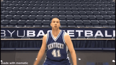 A Kentucky Basketball Player Wearing Number 41 Stands In Front Of An Empty Stadium GIF
