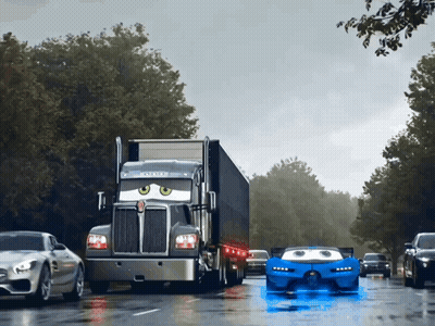 A Kenworth Semi Truck Driving Down A Wet Road GIF