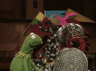 A Kermit The Frog Is Standing Next To A Knight GIF