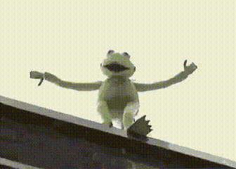 A Kermit The Frog Is Standing On A Ledge With His Arms Outstretched . GIF